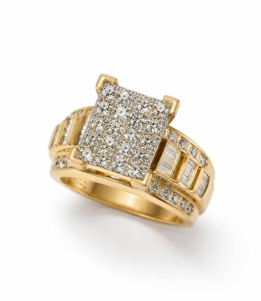 A yellow gold ring featuring a square pavé diamond center stone with baguette and round diamonds set along the band, shown on a clean white background.